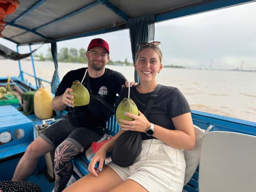From Ho Chi Minh: Cai Be Boat & Bike Mekong Delta Experience - The Tien River stretch: tea, photos, a show, and river travel